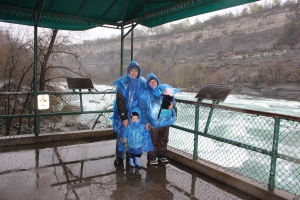 My family in front of the level 6 rapids in Niagara Falls, Ontario.  Can you believe people have been absurd enough to try and swim these?!